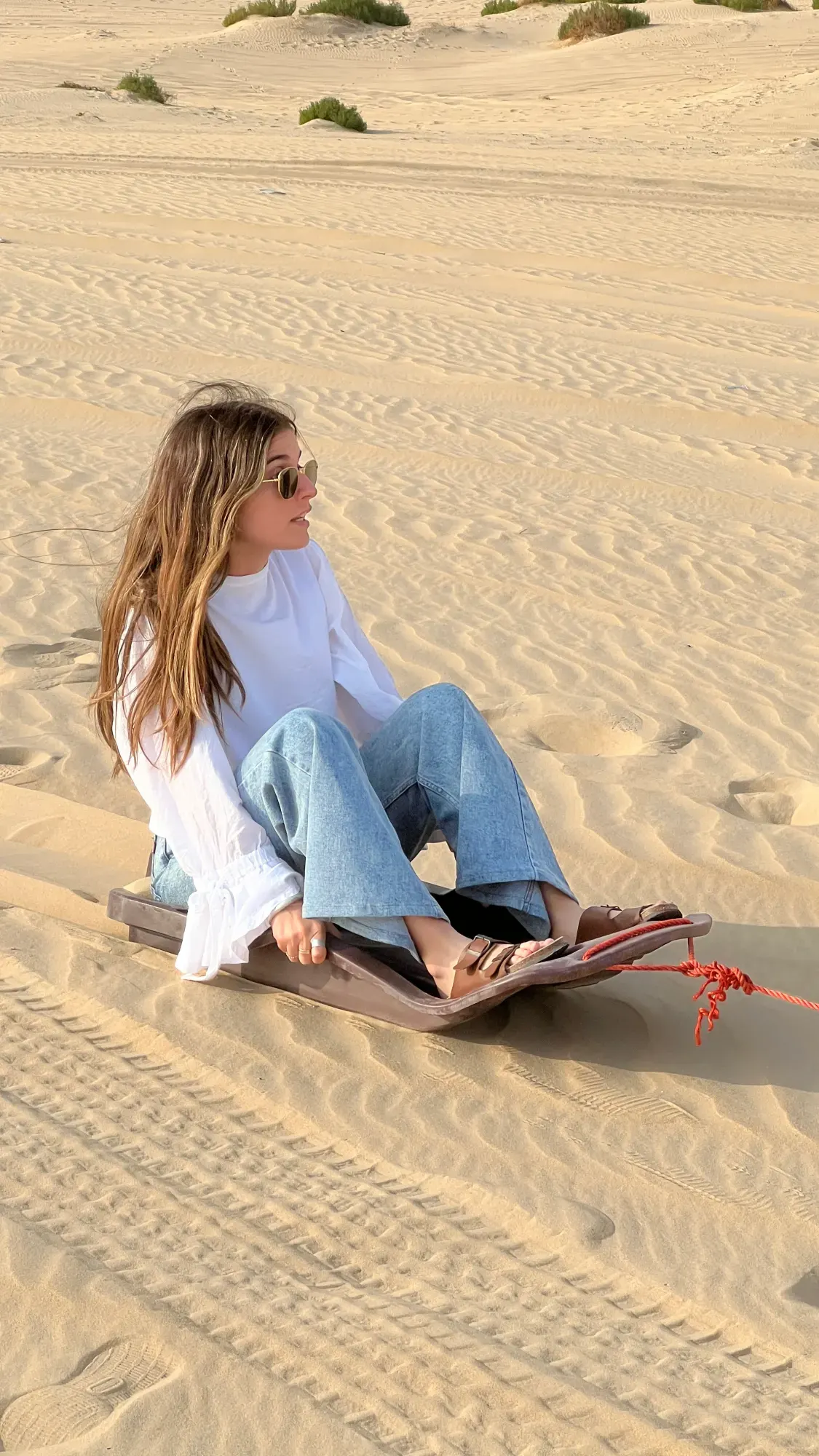 Sandboarding during a desert safari in Dammam