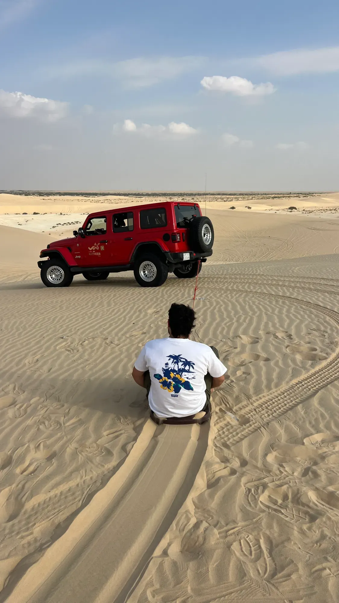 Sandboarding during a desert safari in Dammam